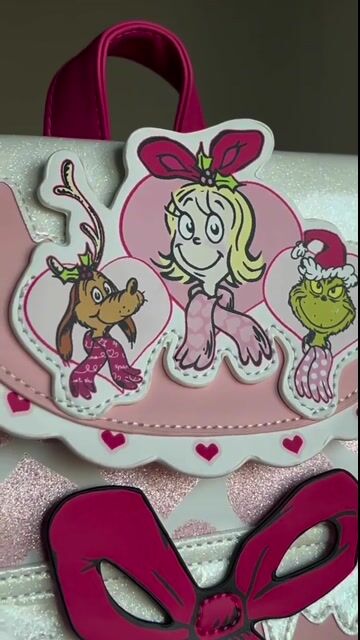 Bring some merry magic to your outfit with this exclusive Dr. Seuss Pink Cindy Lou Who Mini Backpack! Designed with playful accents and the signature Cindy Lou charm, this mini pack is ideal for fans who love a pop of pastel holiday fun.